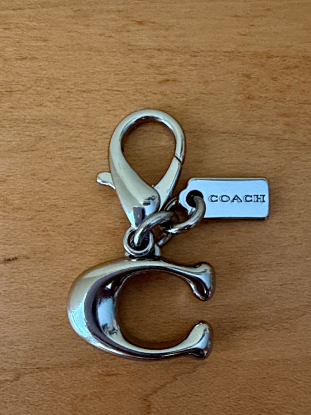 Coach Silver 'C' Charm Clip and miniature Coach tag.